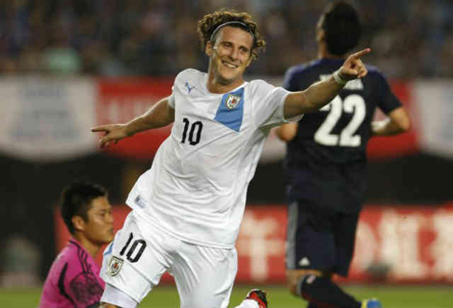 Forlan celebrates his amazing goals against Japan