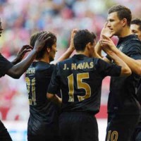 Manchester City celebrate with Dzeko for the two goals which he has scored