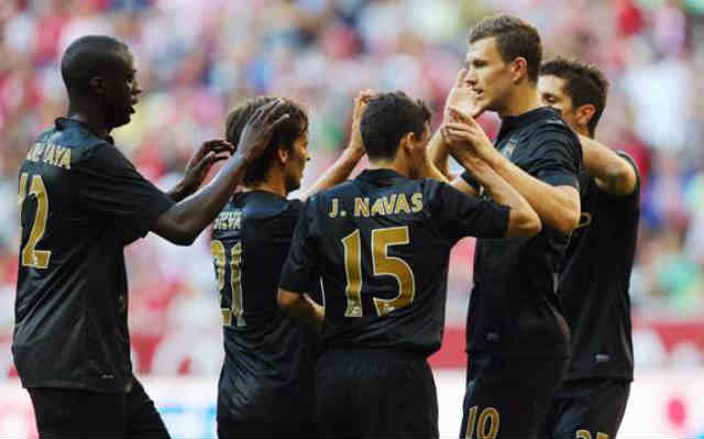 Manchester City celebrate with Dzeko for the two goals which he has scored