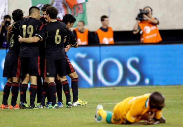 Mexican players celebrate their win against Ivory Coast