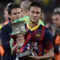 Neymar with the Supercopa trophy after Barcelona have claimed the Spanish Supercopa with 0-0 draw with Atletico Madrid in the second leg at the Nou Camp.-football