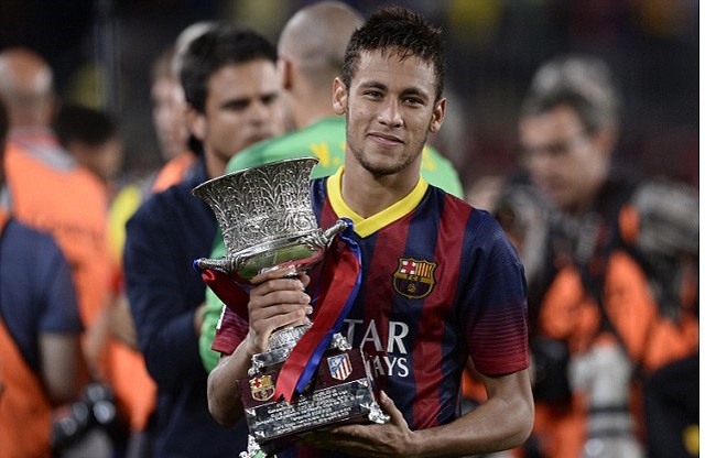 Neymar with the Supercopa trophy after Barcelona have claimed the Spanish Supercopa with 0-0 draw with Atletico Madrid in the second leg at the Nou Camp.-football