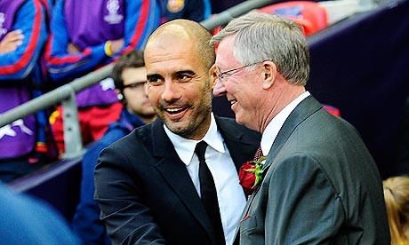 Management greats Pep Guardiola and Sir Alex Ferguson share a handshake