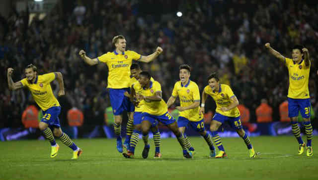Arsenal celebrate as they take it in penalties
