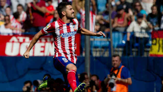 David Villa celebrates his goal in style