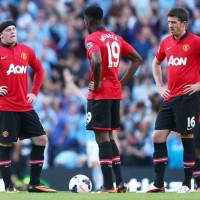 Manchester United players dejected in loss to neighbours City.