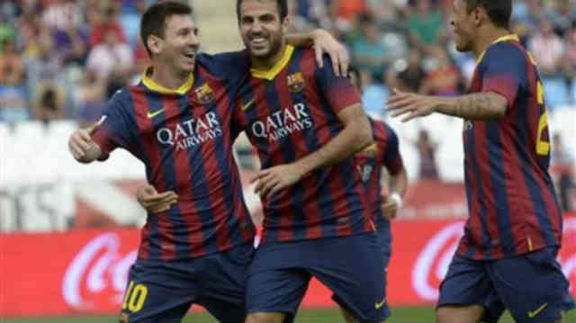 Messi celebrates with his team his goal