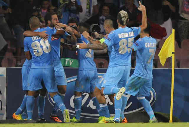 Napoli team celebrate with Higuain for his goal against AC Milan