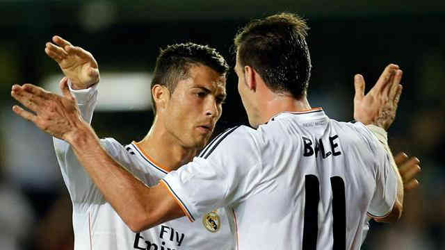 Ronaldo celebrates his goal with new team mate, Gareth Bale