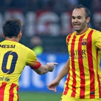 Lionel Messi celebrates his goal with Iniesta against AC Milan