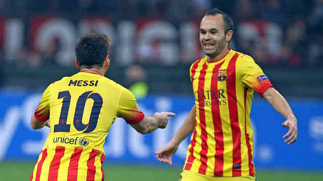 Lionel Messi celebrates his goal with Iniesta against AC Milan