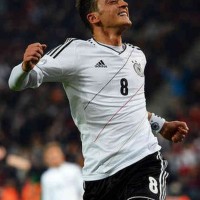 Mesut Ozil celebrates his smashing goal as he celebrates for taking Germany to the World Cup