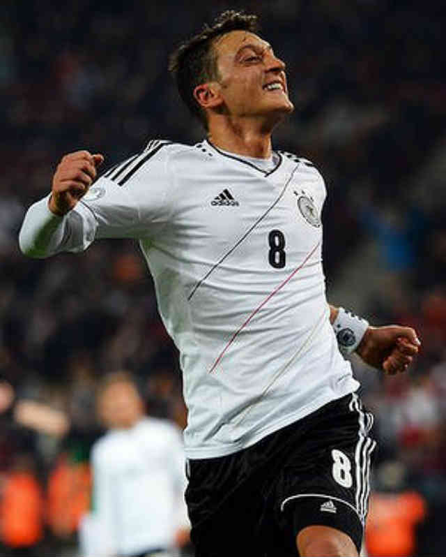 Mesut Ozil celebrates his smashing goal as he celebrates for taking Germany to the World Cup