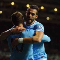 Negredo celebrates his goal with Dzeko