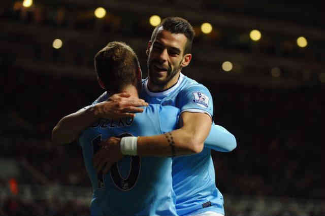 Negredo celebrates his goal with Dzeko