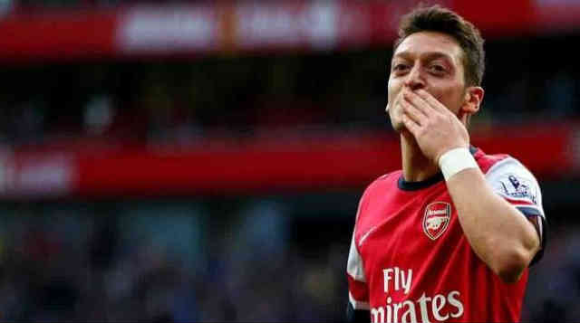Ozil celebrates his goal with the Gunners