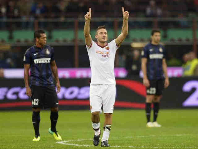 Totti celebrates his smashing goal against Inter Milan