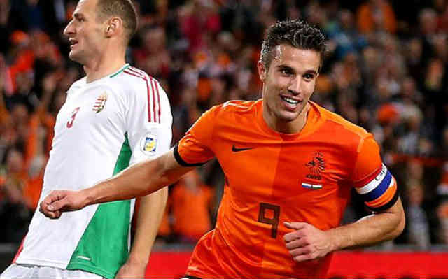 Van Persie celebrates and Holland qualify to the World Cup