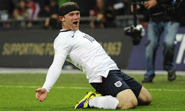 Wayne Rooney celebrates his opener goal for England