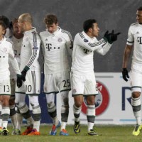 Bayern Munich celebrate their win and get through to the next stage of the Champions League