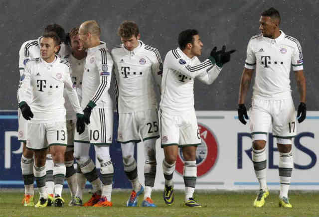 Bayern Munich celebrate their win and get through to the next stage of the Champions League