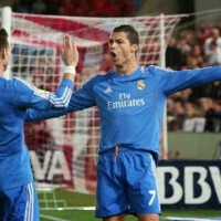 Ronaldo and Bale both celebrate their goals against Almeria