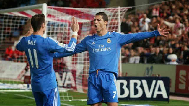 Ronaldo and Bale both celebrate their goals against Almeria