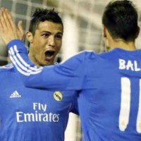 Ronaldo celebrates with his team mate Gareth Bale with his goal