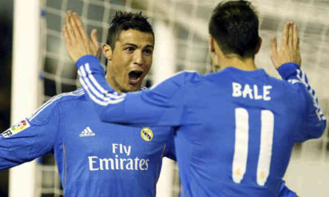 Ronaldo celebrates with his team mate Gareth Bale with his goal
