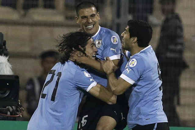 Uruguay celebrate their smashing win against Jordan