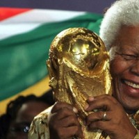 Nelson Mandela holding the World Cup