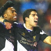 Suarez and Sturridge both celebrate their goals against Stoke City