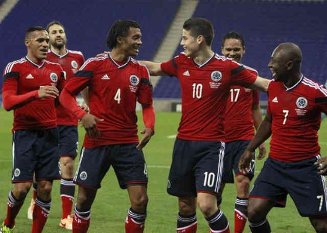 Colombian team celebrate their goal but was not enough to win their match